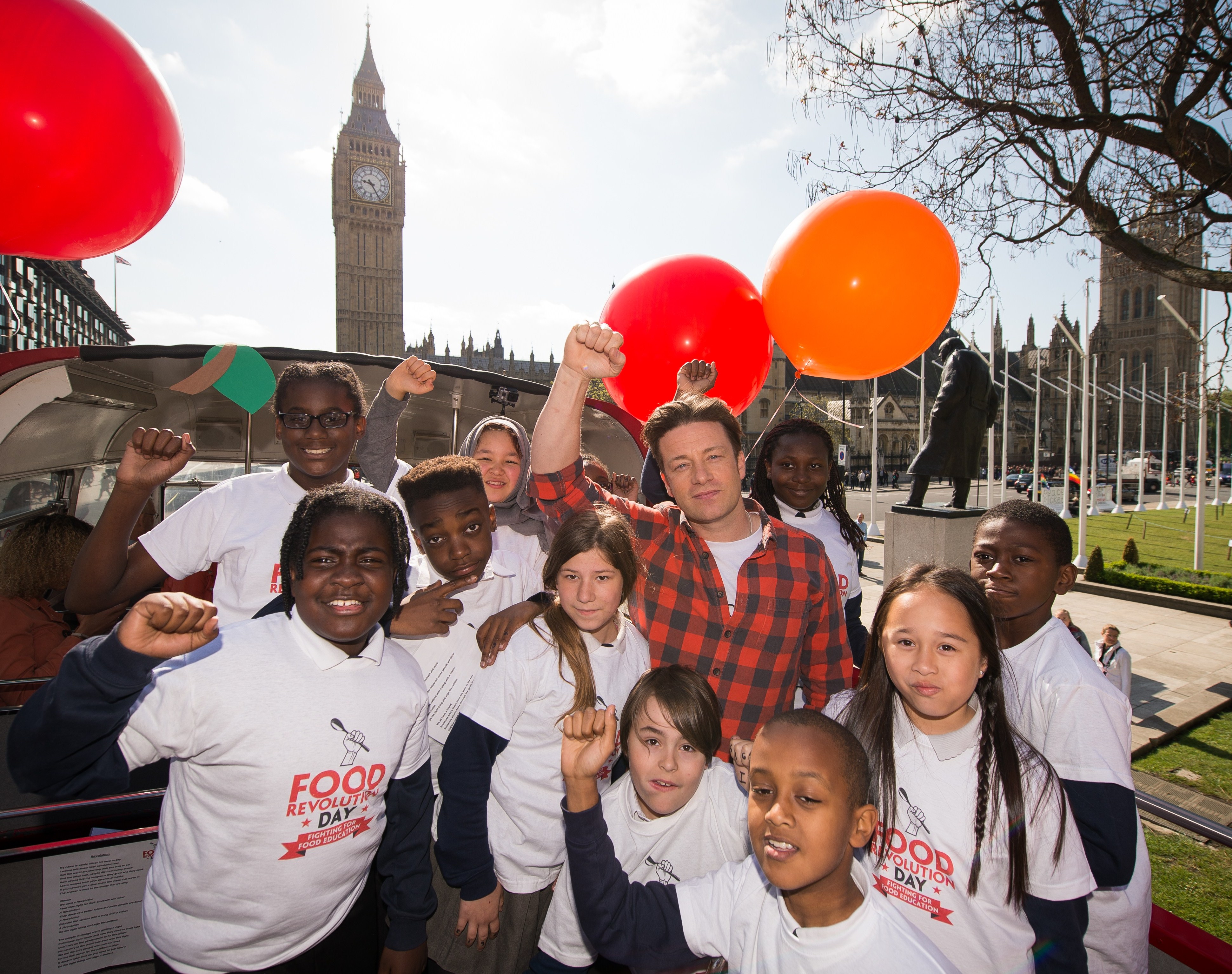Jamie Oliver with school children in London promoting Food Revolution Day.