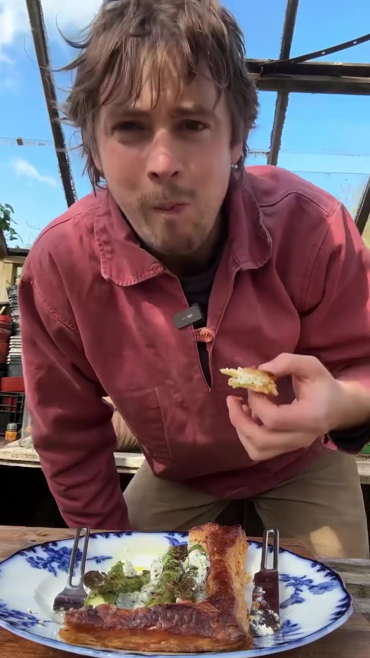 Chef eating British asparagus puff tart.