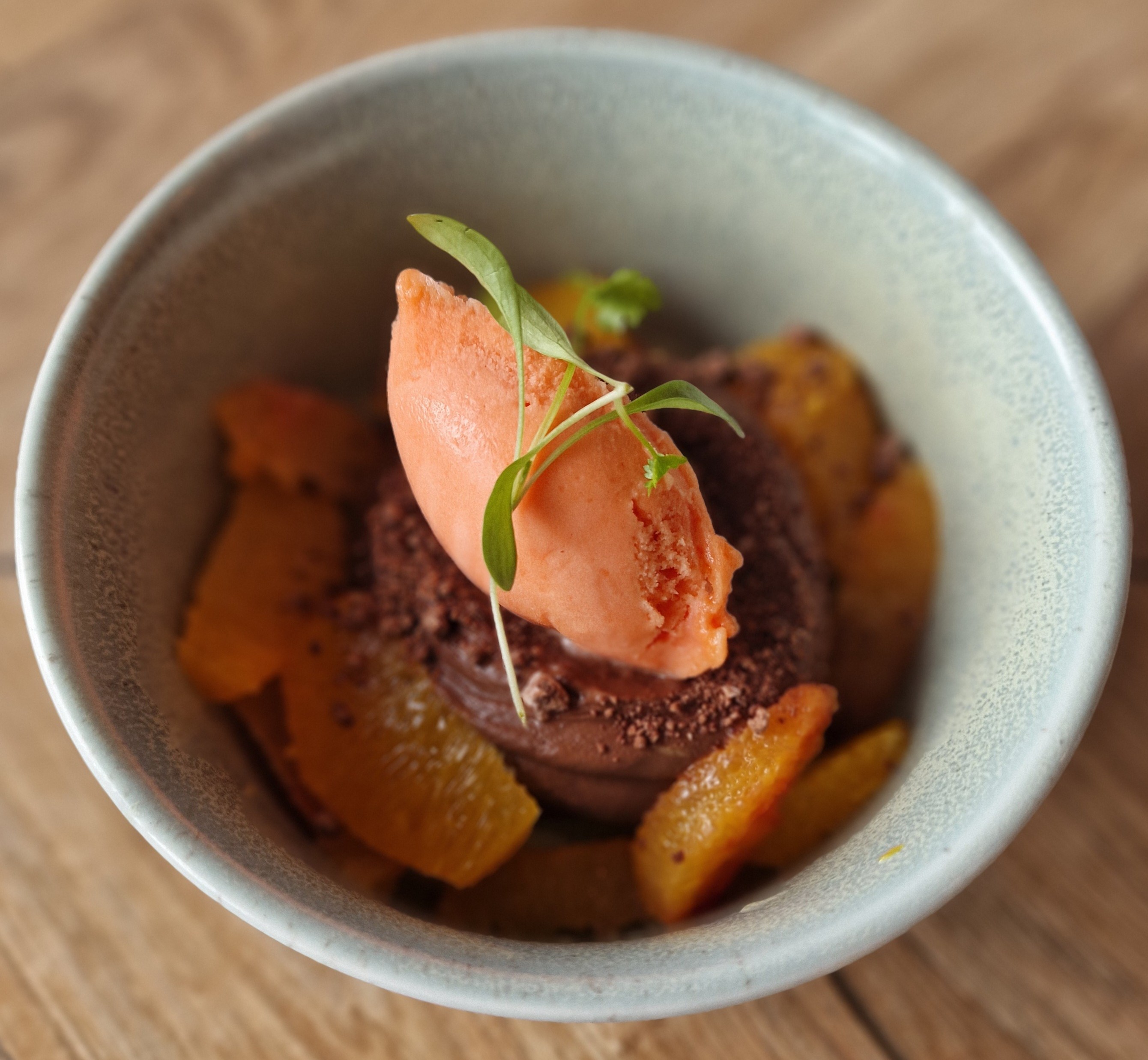 Chocolate orange cremeux with orange segments and sorbet.
