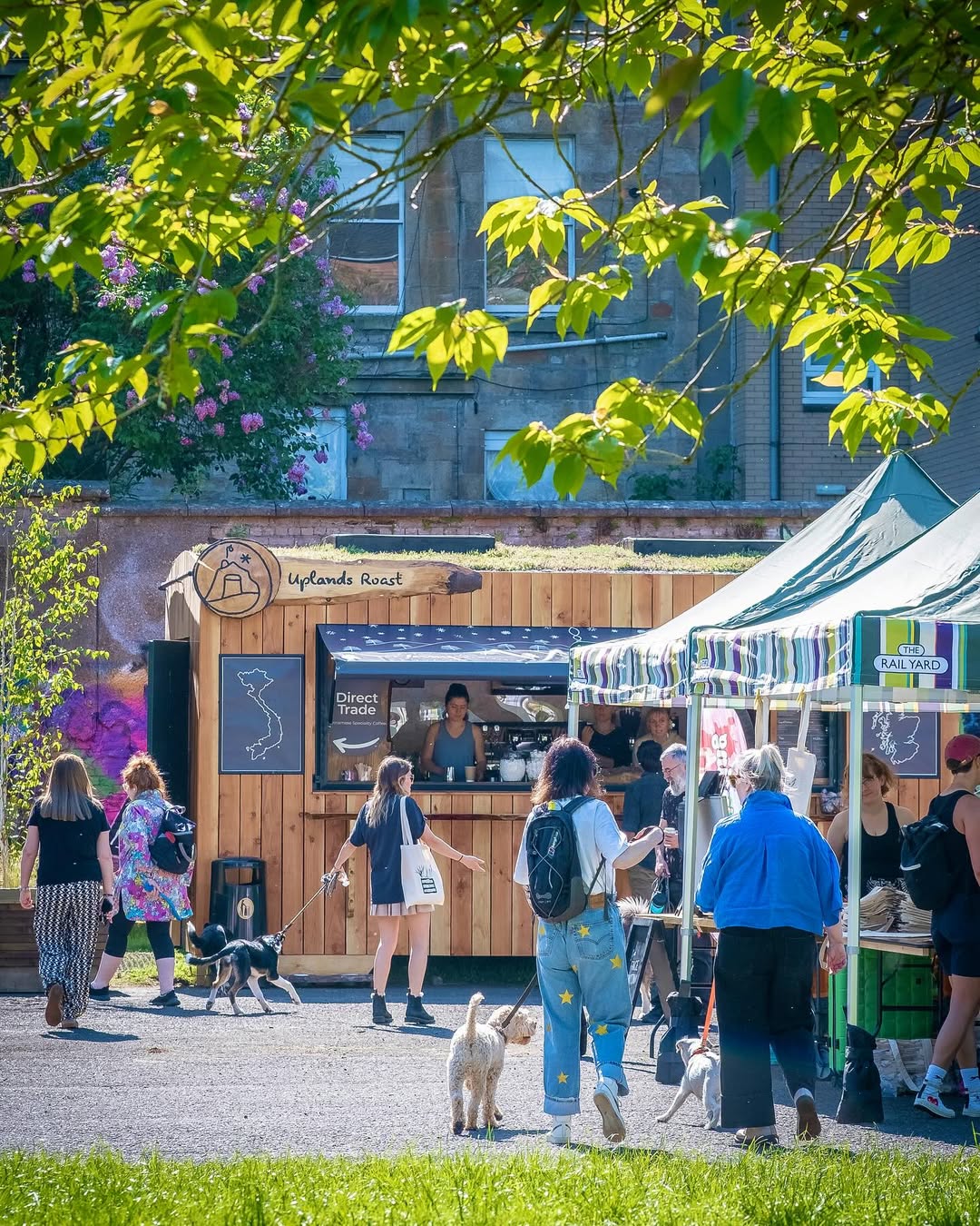 Rail Yard Market in Glasgow, featuring dynamic food stalls and crowds.