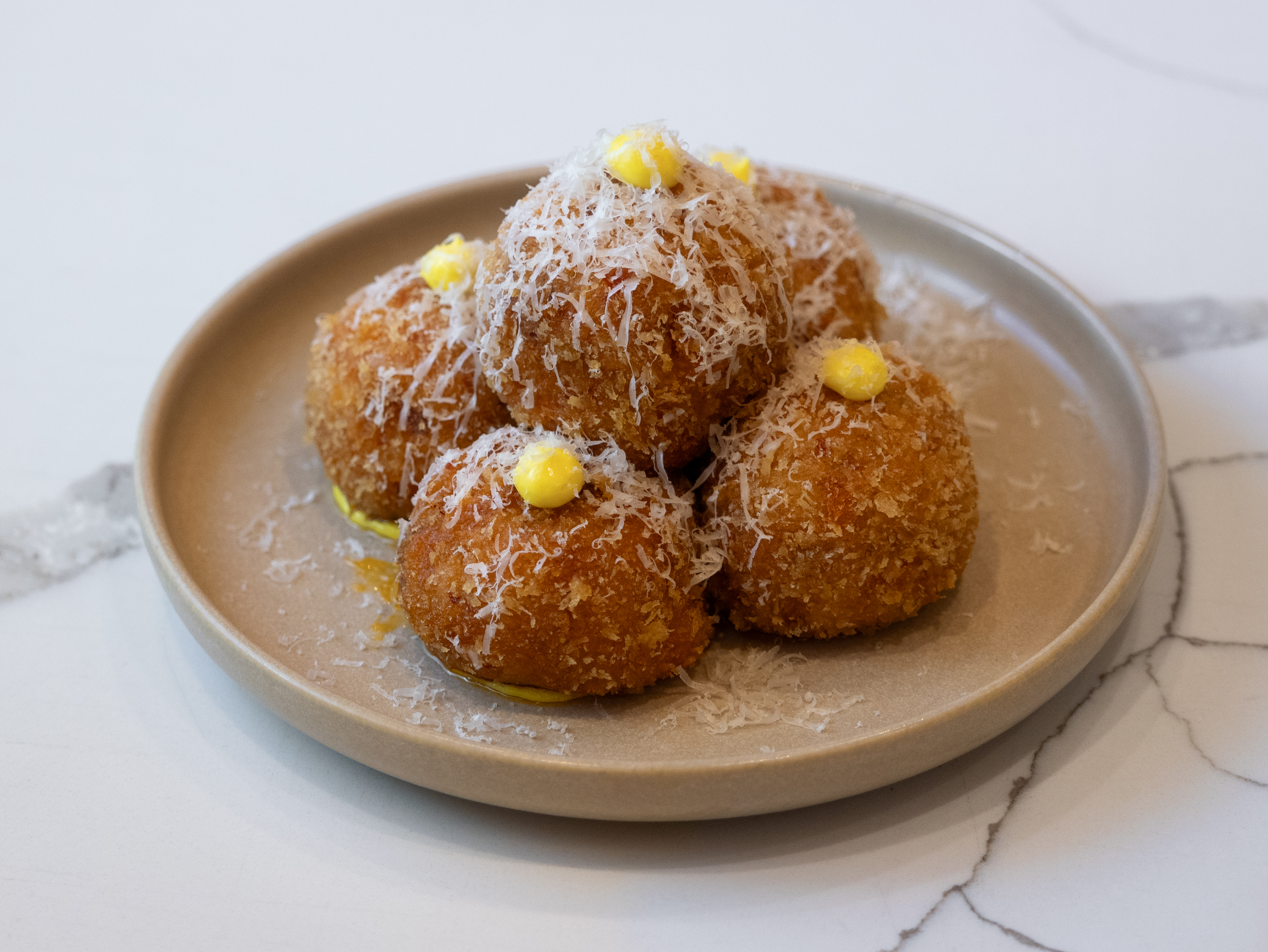Crunchy arancini at Valor outlet.