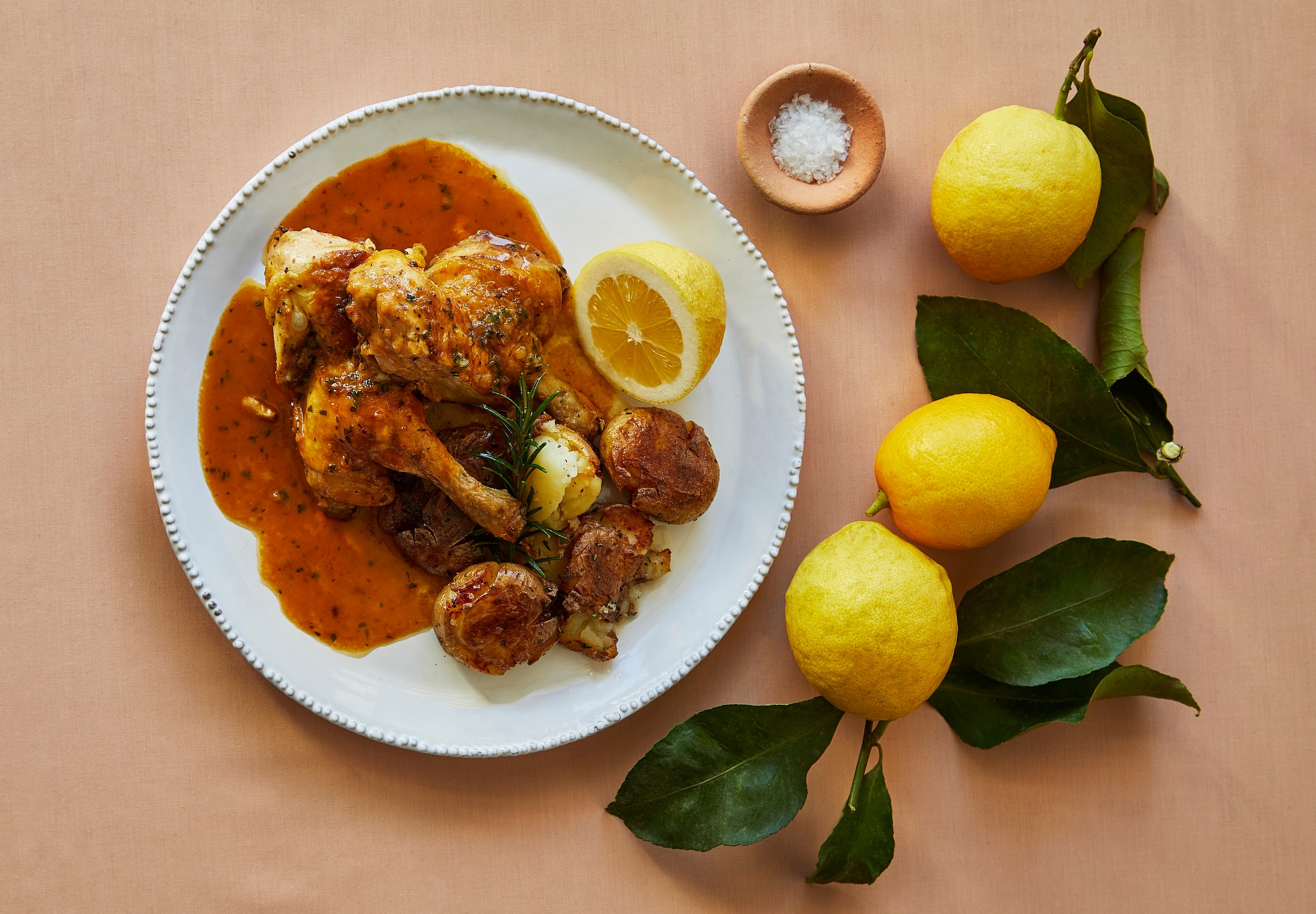 Roast chicken with potatoes and lemon.